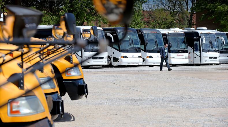 Tom Sambdman, co-owner of Samson Tours whose coaches and school buses sit idle, is waiting for federal relief loans and trying to decide how to use them on Wednesday, April 15, 2020, in Atlanta. The company wants to pay their staff of 72 employees but has no work for them until the summer. Curtis Compton ccompton@ajc.com
