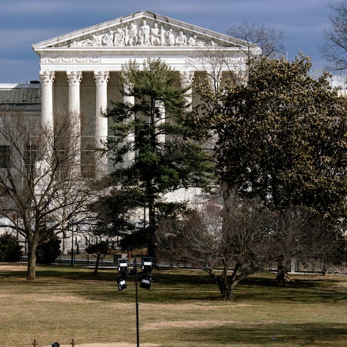 FILE - The Supreme Court is seen in the distance, framed through columns of the U.S. Senate at the Capitol in Washington, Feb. 20, 2025. (AP Photo/J. Scott Applewhite, File)