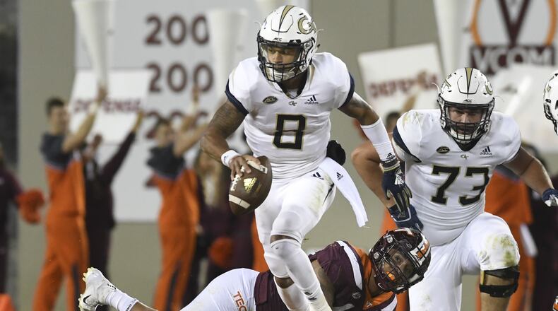 Georgia Tech's Tobias Oliver leaves another Virginia Tech defender in his wake Thursday night.(Michael Shroyer/Getty Images)