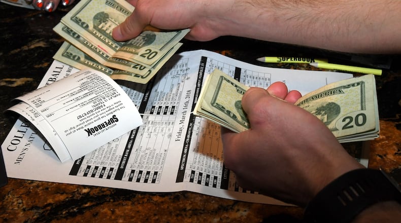 Somebody puts down a wager during the NCAA men’s  college basketball tournament at the Westgate hotel and casino race and sportsbook in Las Vegas in March. Sportsbooks may soon become common across the U.S.