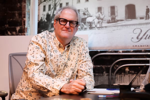 Variety Playhouse General Manager Brad Syna at his desk at the Little Five Points concert venue. (Abbey Cutrer/AJC)