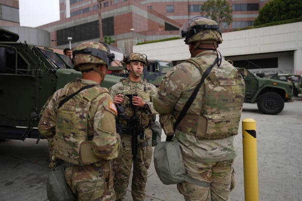 U.S. National Guard are deployed around downtown Los Angeles, Sunday, June 8, 2025, following an immigration raid protest the night before. (AP Photo/Eric Thayer)