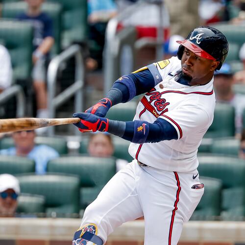 Atlanta Braves' Ozzie Albies hits a double against the New York Mets during the first inning of a baseball game, Sunday, July 5, 2026, in Atlanta. (AP Photo/Erik S. Lesser)