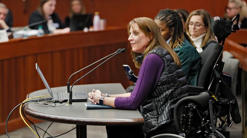 Acworth resident Janet Paulsen told a Senate panel that she would likely not be paralyed if the protective order she took out on her estranged husband had prohibited him from owning a gun.   Bob Andres / bandres@ajc.com