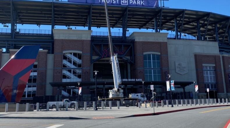 A temporary Truist Park sign was placed atop the third-base side of the Braves’ stadium Friday.