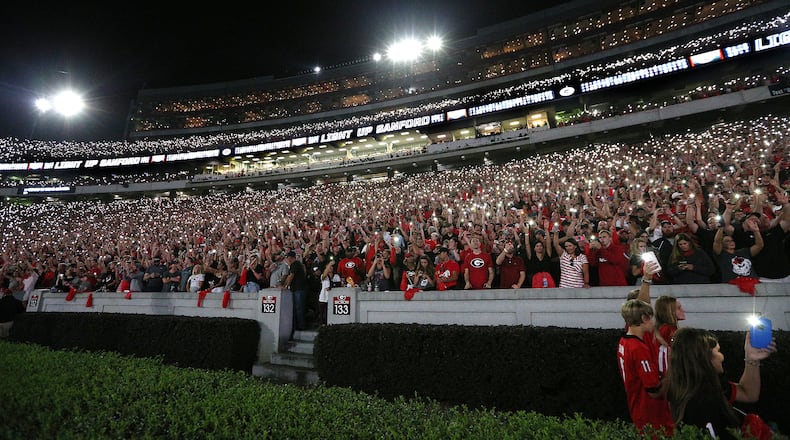Georgia fans light up Sanford Stadium to begin the fourth quarter.  Curtis Compton/ccompton@ajc.com