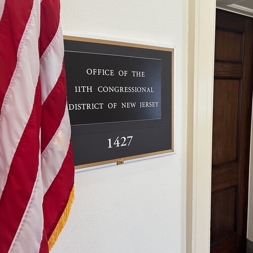 An American flag hangs outside the Office of the 11th Congressional District in the Longworth House Office Building in Washington on Thursday, April 2, 2026. (AP Photo/Robert Yoon)