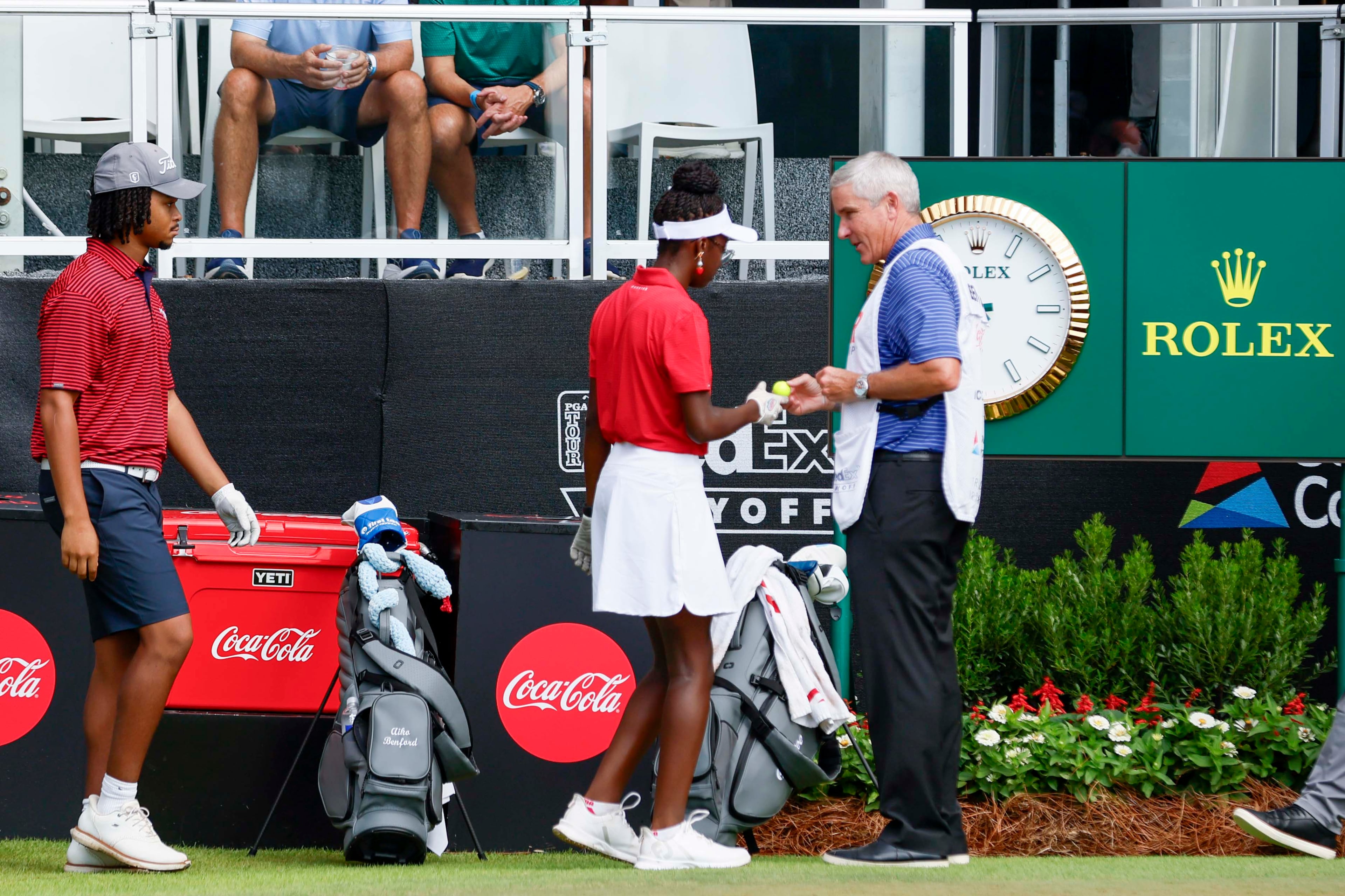 First tee Metro Atlanta members Aiko Benford and Samuel West are greeted by LPG Jay Monahan for the ceremonial opening tee during the first round of the Tour Championship at East Lake Golf Club on Thursday, Aug. 21, 2025, in Atlanta. (Miguel Martinez/AJC)