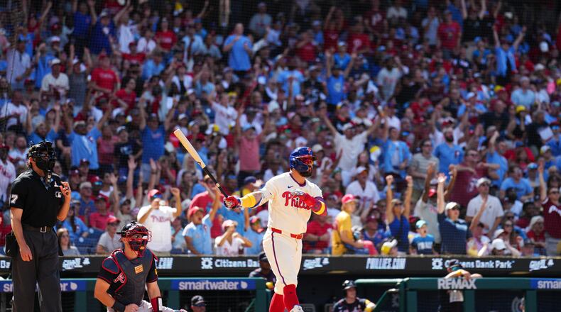 Philadelphia Phillies' Kyle Schwarber, right, watches his solo home run off Atlanta Braves pitcher Dylan Dodd during the seventh inning of a baseball game, Sunday, Sept. 6, 2026, in Philadelphia. (AP Photo/Derik Hamilton)