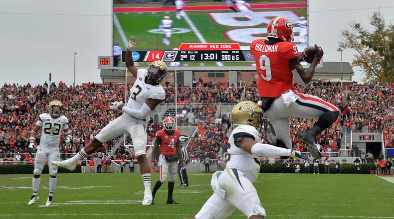 Georgia wide receiver Jeremiah Holloman (9) catches a touchdown pass at Sanford Stadium on Saturday, November 24, 2018. HYOSUB SHIN / HSHIN@AJC.COM
