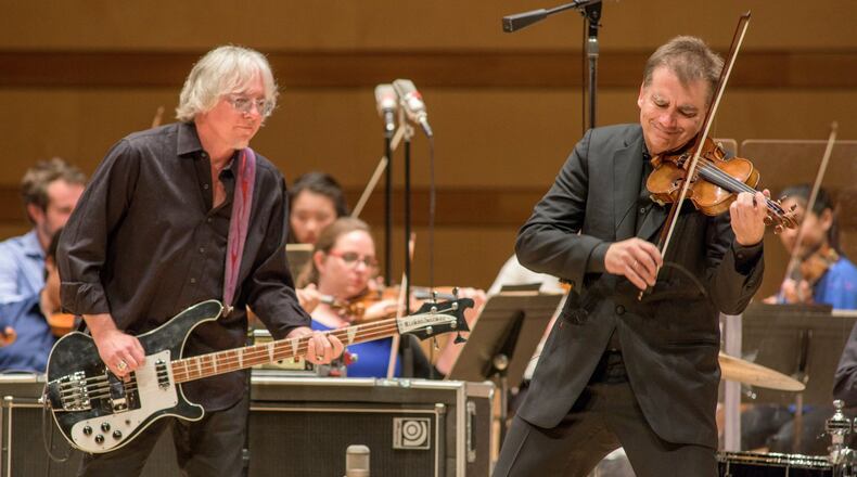 Violinist Robert McDuffie and R.E.M. bassist Mike Mills, who were childhood friends in Macon, will perform Mills’ “Concerto for Rock Band, Violin and Strings” at Emory’s Schwartz Center for the Performing Arts on Oct. 28. COURTESY ALEX IRVIN