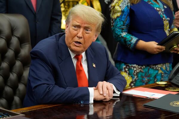 President Donald Trump answers questions from reporters as he meets with Congo's Foreign Minister Therese Kayikwamba Wagner, and Rwanda's Foreign Minister Olivier Nduhungirehe, Friday, June 27, 2025, in the Oval Office at the White House in Washington. (AP Photo/Manuel Balce Ceneta)