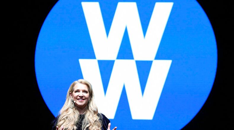 Weight Watchers President and Chief Executive Officer Mindy Grossman speaks at a global employee event in New York. Weight Watchers says it is renaming itself to WW to focus more on overall wellness and not just dieting. (Amy Sussman/AP Images for Weight Watchers, File)