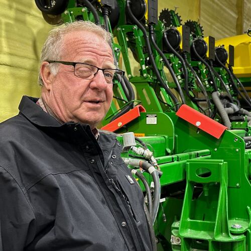 Tom Waters, a seventh-generation farmer, stands next to his planting machinery Friday, March 13, 2026, in Orrick, Mo. (AP Photo/Nick Ingram)
