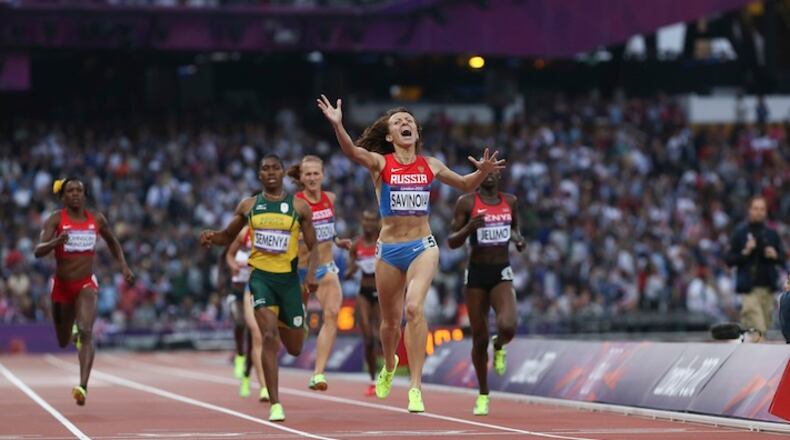 FILE — Mariya Savinova, of Russia, wins gold in the women’s 800 meter during the 2012 Summer Olympics with Alysia Montano, of the U.S., left, an American 800-meter runner who finished fifth, in London, Aug. 11, 2012. The World Anti-Doping Agency released the findings of its extraordinary inquiry into doping and corruption in Russian track and field, recommending Russia be suspended from track and field competition, including next year’s Olympics in Rio de Janeiro. (Josh Haner/The New York Times)