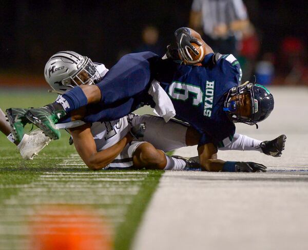 Houston County linebacker Jayson Hodges (15) forces Harrison running back David Roberts (6) out of bounds in the first half of their game at Harrison High School Friday, November 29, 2019. PHOTO/Daniel Varnado