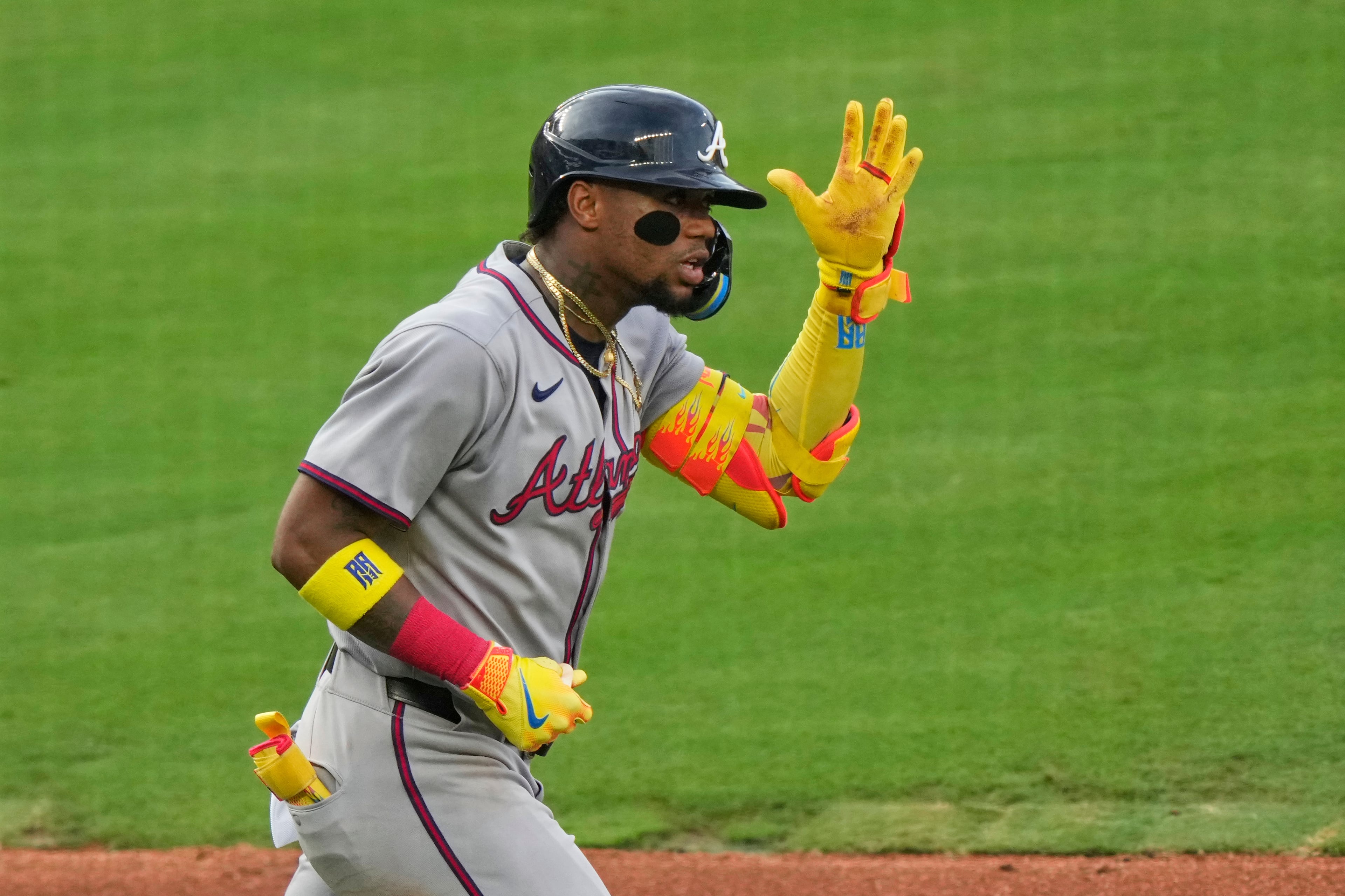 Atlanta Braves' Ronald Acuna Jr. celebrates after hitting a two-run home run during the third inning of a baseball game against the Kansas City Royals, Monday, July 28, 2025, in Kansas City, Mo. (AP Photo/Charlie Riedel)