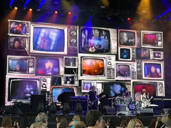 Joan Jett's backdrop was compiled of multiple TVs playing her old videos. (Rodney Ho/AJC)