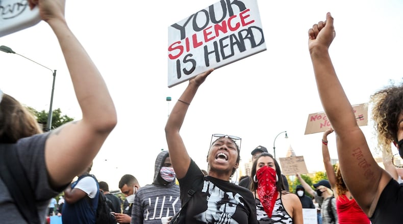 June 1, 2020 -  Atlanta - Seria Hunter of Doraville leads a chant the intersection of Centennial Olympic Park Drive NW and Marietta Street NW.   Protestors were active downtown as protests continued for a fourth day.  Protests over the death of George Floyd in Minneapolis police custody continued around the United States, as his case renewed anger about others involving African Americans, police and race relations.     Alyssa Pointer / alyssa.pointer@ajc.com