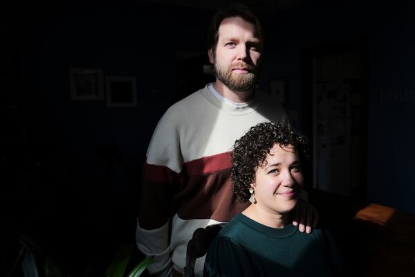 Hannah Jones accompanied by her spouse, Steve Cook, pose for a portrait at home near Philadelphia, Wednesday, March 12, 2025. (AP Photo/Matt Rourke)