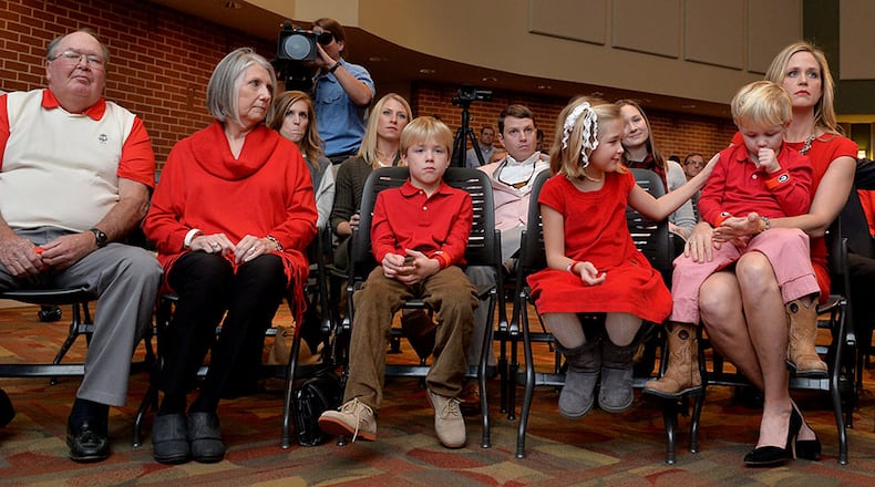 Sonny Smart (left) attends son Kirby’s recent introductory news conference in Athens with his wife, Sharon. Also pictured: Kirby Smart’s children Weston, Julia and Andrew, and his wife, Mary Beth. (Brant Sanderlin/bsanderlin@ajc.com)