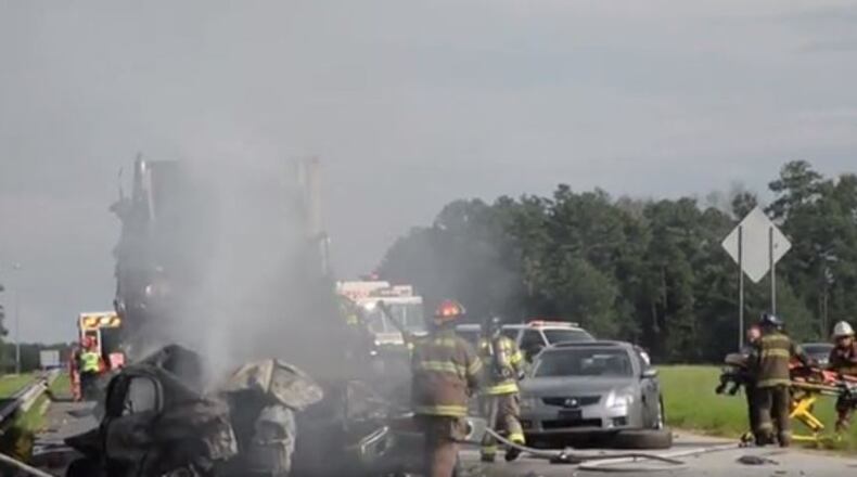 A tractor-trailer crashed into other vehicles Tuesday on I-16 in Macon, killing three people. (Credit: Macon Telegraph)