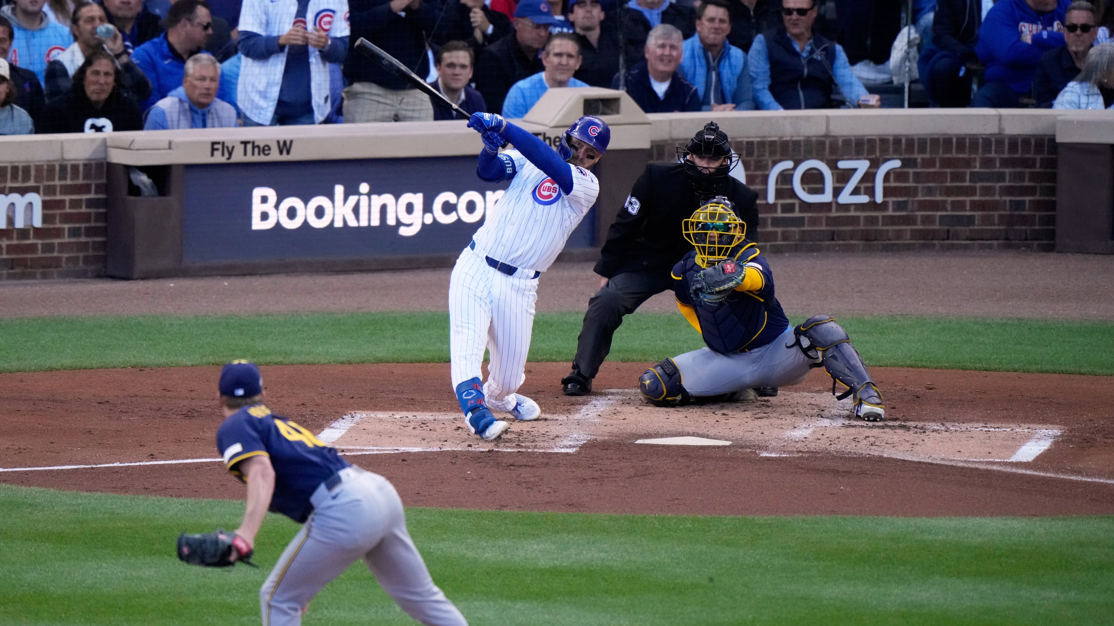 Chicago Cubs' Michael Busch hirts a home run during the first inning of Game 3 of baseball's National League Division Series against the Milwaukee Brewers Wednesday, Oct. 8, 2025, in Chicago. (AP Photo/Nam Huh)
