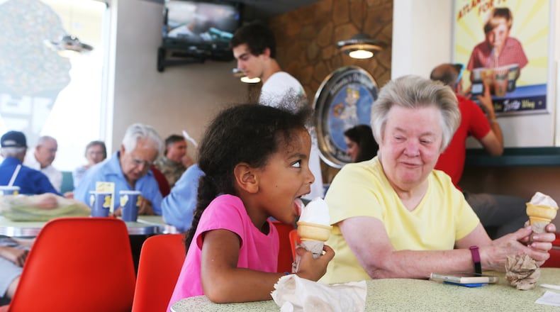 July 1, 2019 Buckhead- Catherine (left) enjoys her vanilla ice cream cone while Barbara (left) looks on during the 70th anniversary celebration for Zesto Atlanta at their Buckhead location off of Piedmont Road NE on Monday, July 1, 2019. Zesto opened in 1945 nationally, moving to Atlanta in 1949. The restaurant eventually had six locations in Atlanta, remaining family owned and operated through its expansion. Today there are four Zesto locations remaining in Atlanta. Zesto celebrated its 70th anniversary with 70 cent chili dogs for its customers, who packed the restaurant during the morning of the all-day celebration. Christina Matacotta/Christina.Matacotta@ajc.com