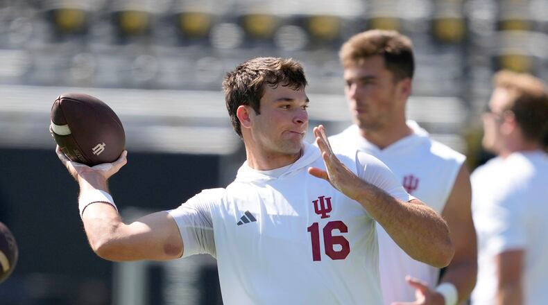 FILE - Indiana quarterback Alberto Mendoza warms up before an NCAA college football game against Iowa, Saturday, Sept. 27, 2025, in Iowa City, Iowa. (AP Photo/Charlie Neibergall, File)