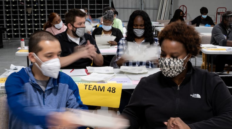 201116-Lawrenceville-Workers count ballots at the Gwinnett County election warehouse in Lawrenceville on Monday evening, Nov. 16, 2020. Ben Gray for the Atlanta Journal-Constitution