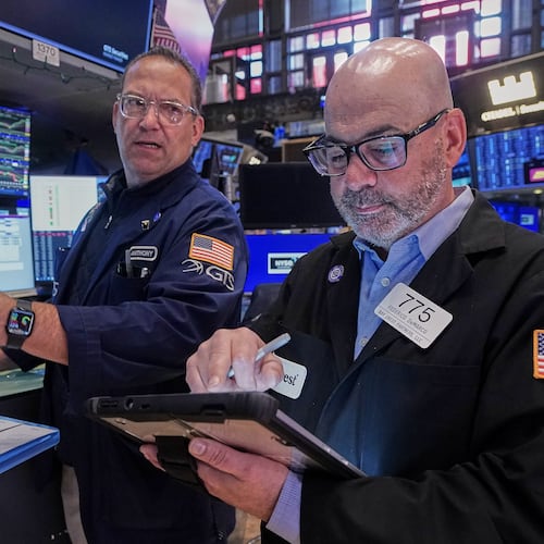 Specialist Anthony Matesic, left, and trader Fred Demarco work on the floor of the New York Stock Exchange, Friday, May 22, 2026. (AP Photo/Richard Drew)