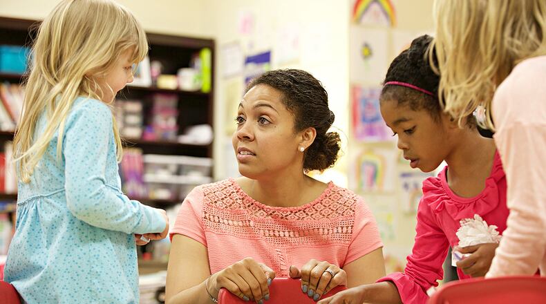 Midtown International School faculty member Kascha Adeleye works with students in her class where enrollment is capped at 12. The school caters to the needs of gifted students.