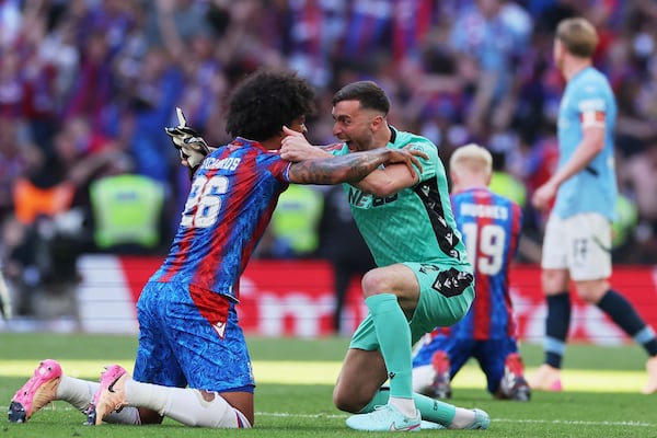 CORRECTS ID TO BACKUP GOALKEEPER MATT TURNER, NOT DEAN HENDERSON - Crystal Palace's Chris Richards and backup goalkeeper Matt Turner celebrate after winning the FA Cup final between Manchester City and Crystal Palace at the Wembley Stadium in London, Saturday, May 17, 2025. (AP Photo/Ian Walton)