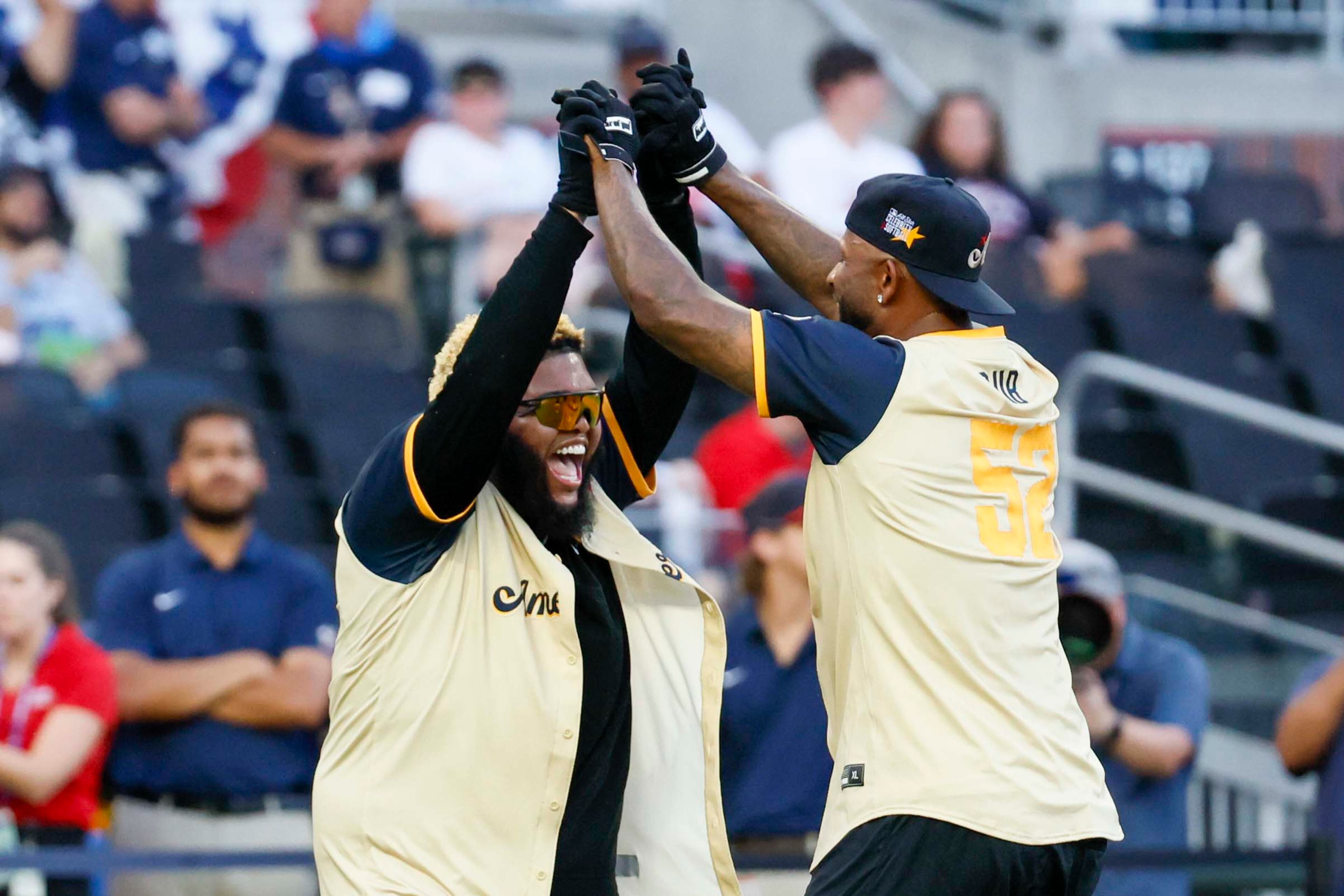 Druski, a social media influencer, comedian, and actor, celebrates with CC Sabathia, a Yankees legend and Hall of Famer, after hitting a home run during the MLB All-Star Celebrity Game at Truist Park on Saturday, July 12, 2025, in Atlanta.
(Miguel Martinez/ AJC)