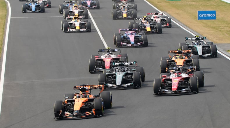 McLaren driver Oscar Piastri of Australia leads the field at the start of the Japanese Formula One Grand Prix at Suzuka in central Japan, Sunday, March 29, 2026. (AP Photo/Eugene Hoshiko)
