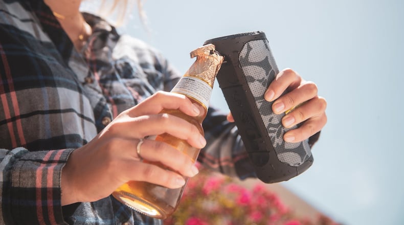 Scosche s Boombottle MM, waterproof wireless speaker with built-in MagicMount, includes the BoomBottle Opener on the back of the speaker. (Handout/TNS)