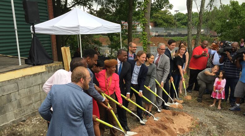 Atlanta Mayor Kasim Reed and City Councilwoman Cleta Winslow help break ground on manufacturing facility on Tuesday for Monday Night Brewing.