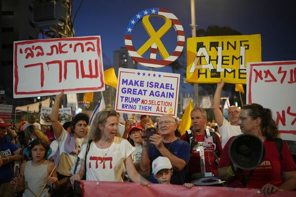 People take part in a protest demanding the end of the war and immediate release of hostages held by Hamas in the Gaza Strip, and against Prime Minister Benjamin Netanyahu's government in Tel Aviv, Israel, Saturday, July 05, 2025. (AP Photo/Ohad Zwigenberg)