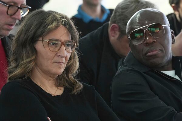 Kylian Mbappe's mother Fayza Lamari, and his father Wilfried Mbappe attend a press conference as Kylian Mbappe's legal team is going on the attack to try and solve the legal dispute between the World Cup winner and his former club PSG, Thursday, April 10, 2025 in Paris. (AP Photo/Michel Euler)