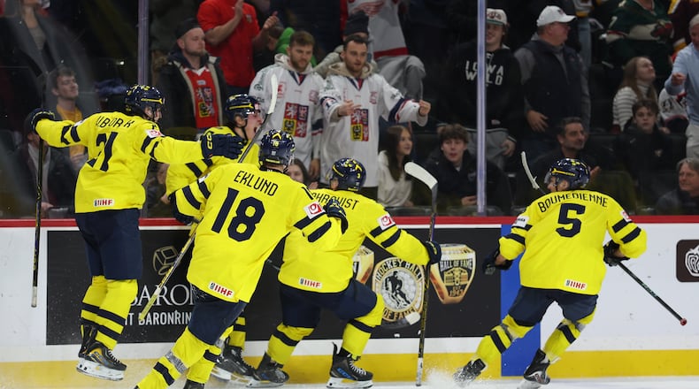 Sweden's Ivar Stenberg (15) celebrates with teammates after scoring a goal during the third period of an IIHF World Junior Hockey Championship gold medal game against Czechia, Monday, Jan. 5, 2026, in St. Paul, Minn. (AP Photo/Matt Krohn)