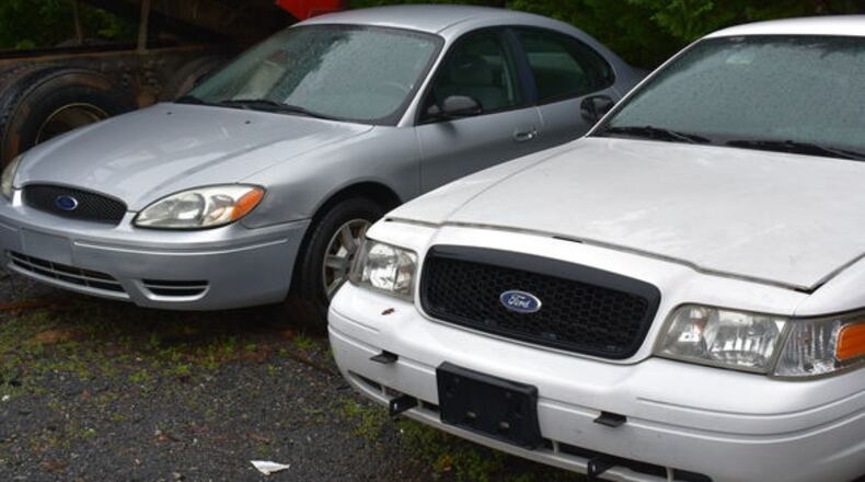 Some of the vehicles sold at auction on behalf of government clients by Jeff Dobson & Associates. Cherokee County has renewed its agreement with Dobson to handle county auctions of surplus vehicles and equipment. JEFF DOBSON & ASSOCIATES