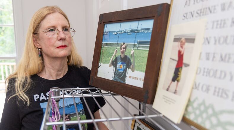 Sharon Winkler looks at photos of her son Alex in her Atlanta home. Winkler is among a group of parents and others fighting what they believes are out-of-control social media sites, memes, and comments that are doing harm to children. In 2017, Winkler's son Alex committed suicide after turning to social media for empathy and advice over a recent break-up with his girlfriend. PHIL SKINNER FOR THE ATLANTA JOURNAL-CONSTITUTION