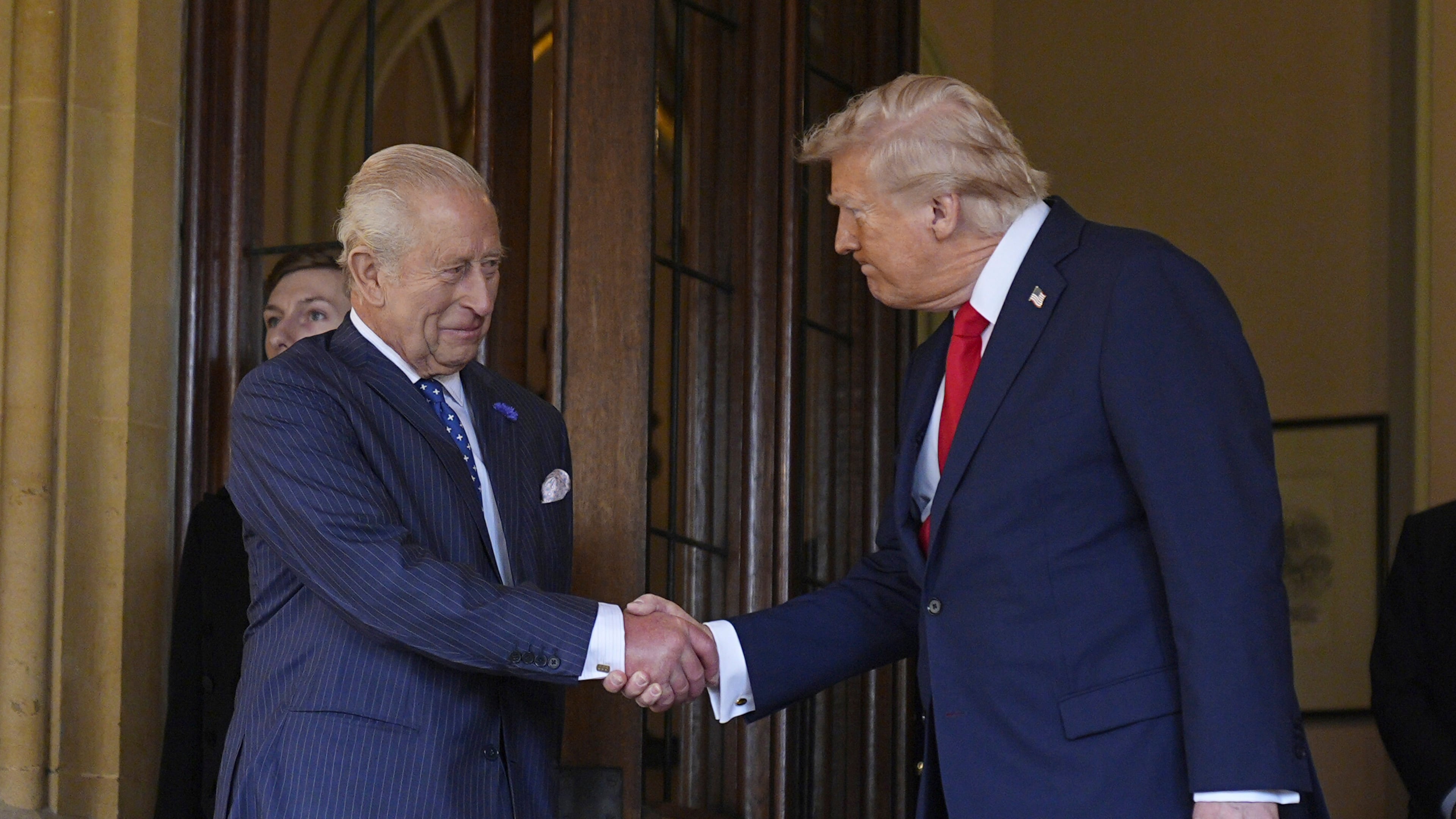 Britain's King Charles III, left, formally bids farewell to US President Donald Trump at Windsor Castle, Windsor, England, Thursday Sept. 18, 2025. (Aaron Chown/Pool Photo via AP)