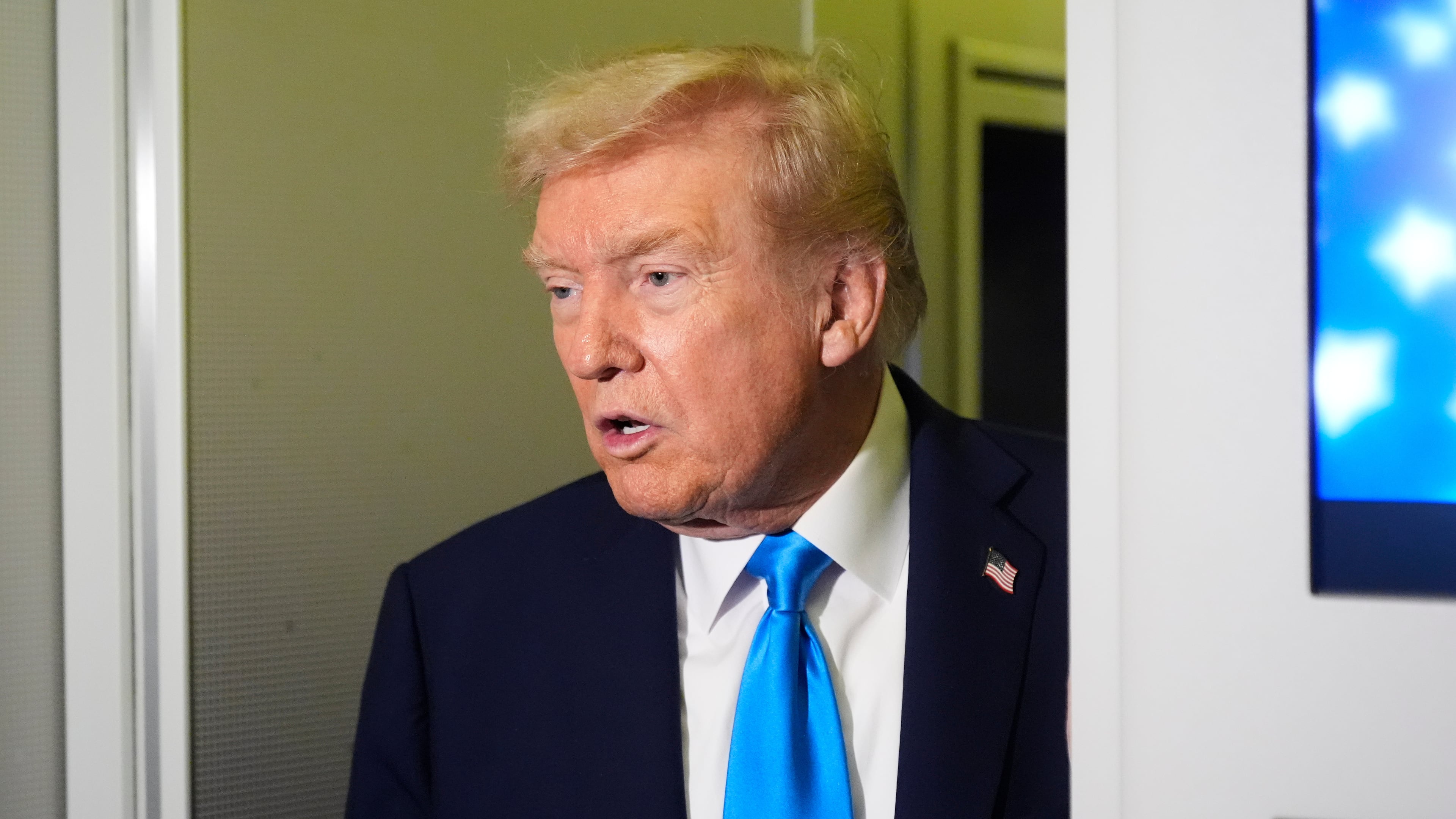 President Donald Trump speaks with reporters aboard Air Force One at Al Udeid Air Base in Doha, Qatar, Saturday, Oct. 25, 2025. (AP Photo/Mark Schiefelbein)