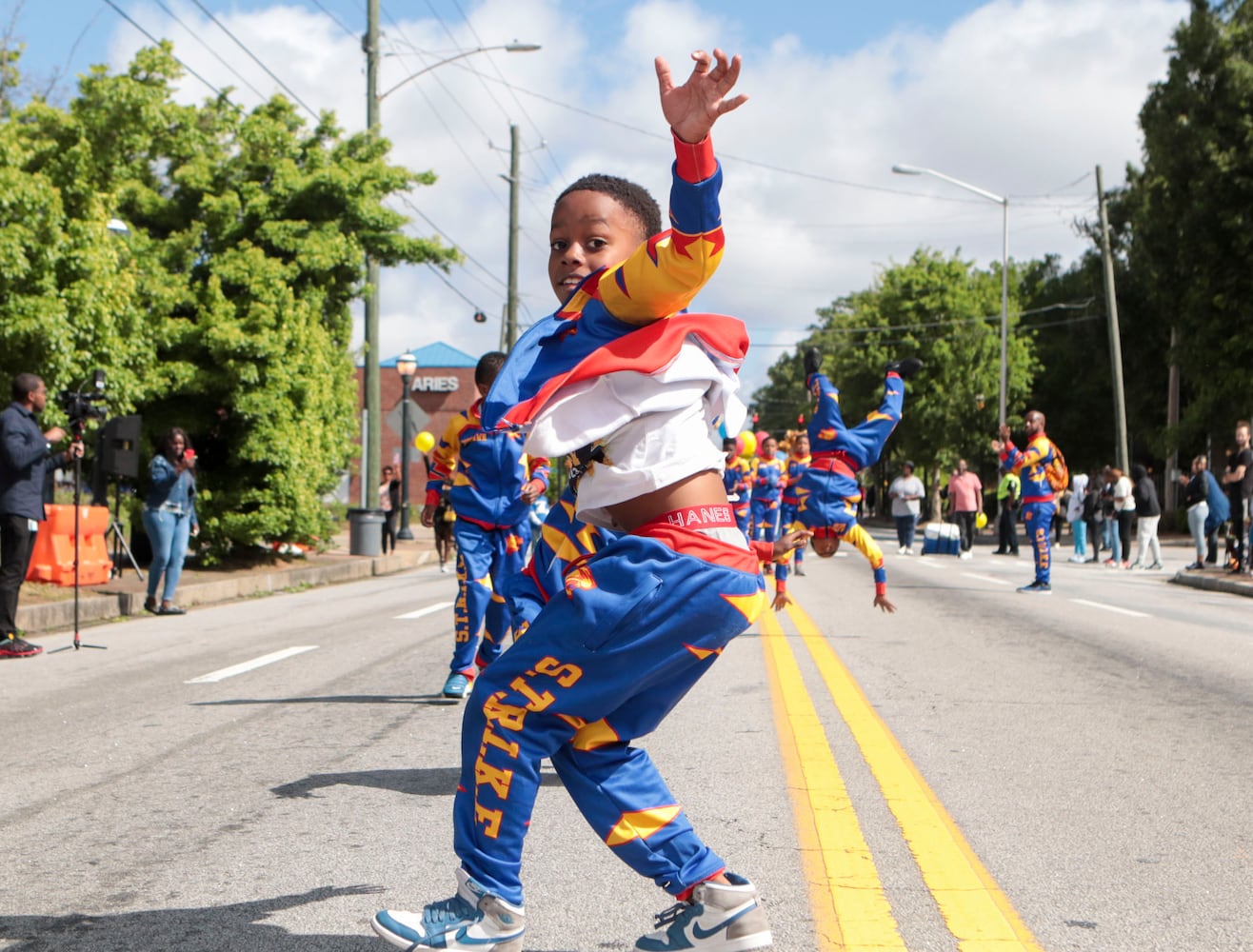 Students perform acrobatics during the Atlanta Public School parade on Saturday, April 22, 2023 on Saturday, April 22, 2023. The parade celebrated the 150th anniversary of Atlanta Public Schools and featured students, teachers and other members of the APS community. CHRISTINA MATACOTTA FOR THE ATLANTA JOURNAL-CONSTITUTION