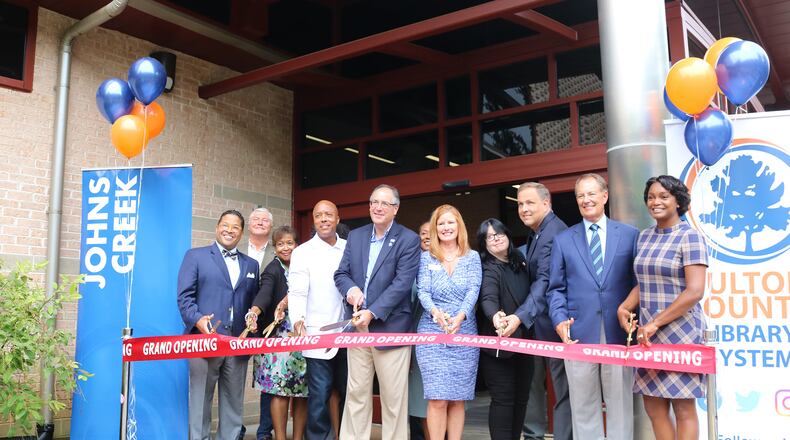 Johns Creek officials including Mayor Mike Bodker, Mayor Pro Tem Lenny Zaprowski, City Council members Brian Weaver, John Bradberry, and Erin Elwood, and Fulton County Commissioner Liz Hausmann helped cut the ribbon at both Northeast Spruill Oaks and Ocee libraries following the completion of renovations.