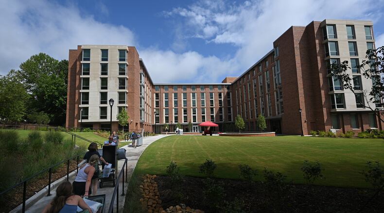 Incoming students move into a University of Georgia residence hall in August. The university will terminate 43 degree programs, part of a larger effort to clean up and streamline degree programs with low enrollments throughout the University System of Georgia. (Hyosub Shin / Hyosub.Shin@ajc.com)