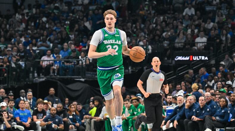 Dallas Mavericks' Cooper Flagg brings the ball up court during an NBA basketball game against the Chicago Bulls Sunday, April 12, 2026, in Dallas. (AP Photo/Albert Pena)