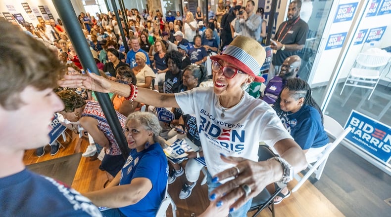 Rochelle Jackson (Right) gives Parker Short, the president of Georgia Young Democrats, a hug after his speech at the Biden-Harris and Georgia Democrats for DeKalb County Office Opening in Decatur on Saturday, July 6, 2024. (Steve Schaefer / AJC)