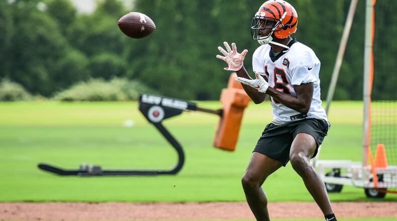 Bengals' wide receiver A.J. Green catches a pass during organized team activities Tuesday, May 22 at the practice facility near Paul Brown Stadium in Cincinnati. NICK GRAHAM/STAFF